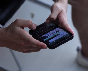 person holding black iphone 4